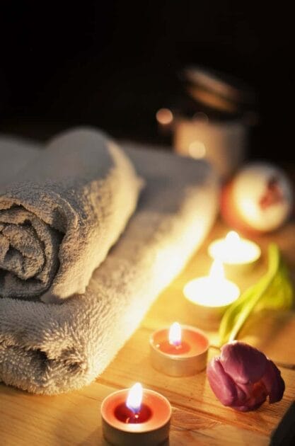 Four Lit Tealights and Massage Towels. Brisbane Livewell Clinic