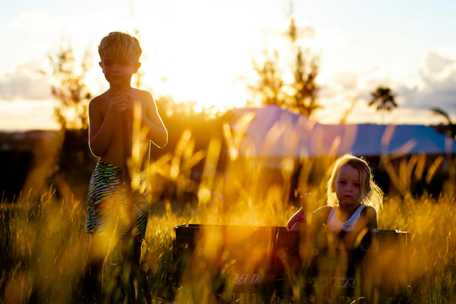 Two children on grass field during daytime. Brisbane Bowen Therapy